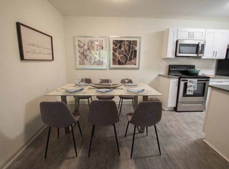Cook in your gourmet kitchen at Icon Avondale. Chairs, table, dining set, table that seats six people.